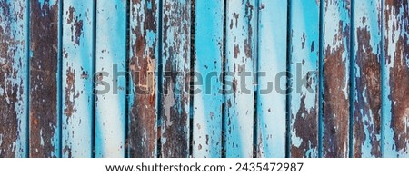 Aged Patina on Weathered Blue Wooden Boards. The Rustic Charm of Faded Paint and Time-Worn Wood. Outdoor Royalty-Free Stock Photo #2435472987
