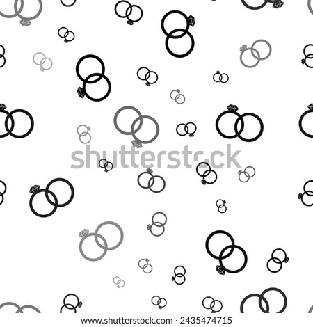 Seamless vector pattern with wedding rings symbols, creating a creative monochrome background with rotated elements. Vector illustration on white background