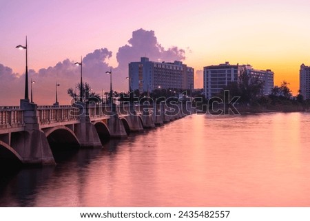 San Juan Sunrise Cityscape over Puente Dos Hermanos Bridge, opened in 19010, connecting Condado with Old San Juan crossing over Laguna del Condado in Puerto Rico Royalty-Free Stock Photo #2435482557