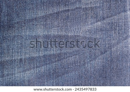 wrinkle effect background on blue jeans, denim wrinkle texture