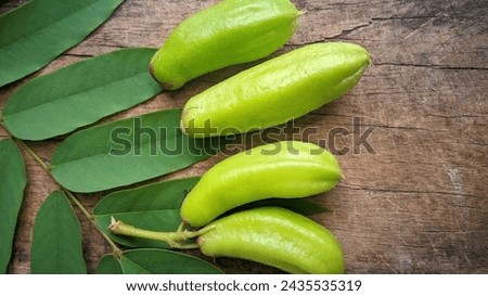 Averrhoa starfruit or Oxalidaceae, Cucumber Fruit with a fresh sour taste with a wooden texture background