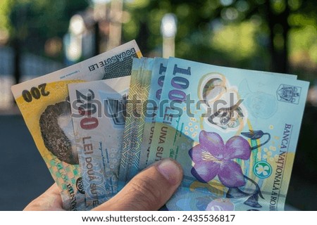 Romanian banknotes of 50, 100 and 200 lei in hand. Romanian LEI currency, close up. Romanian money hand. Making payments, inflation and economic situation concept
 Royalty-Free Stock Photo #2435536817
