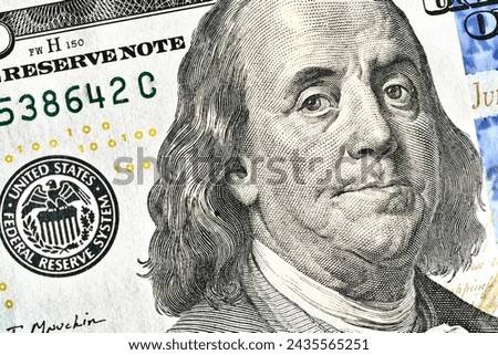 Close-up of a hundred dollar bill of the USA. View from above. Macro photo.