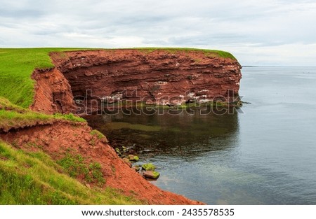 Cape Tryon. Sandstone cliffs along the Gulf of Saint Lawrence, Atlantic Ocean. Coastal erosion, Prince Edward Island north shore, Canada. Royalty-Free Stock Photo #2435578535