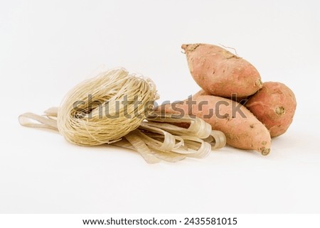 Various sweet potato vermicelli on monochrome background