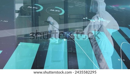Image of financial data processing over people wearing safety suits disinfecting office. global business and digital interface during covid 19 pandemic concept digitally generated image.
