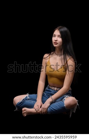 studio portrait of a young girl in torn jeans 4 Royalty-Free Stock Photo #2435595959