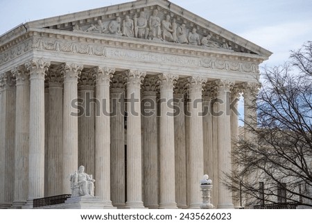 U.S. Supreme Court building with blue sky background in Washington D.C. 