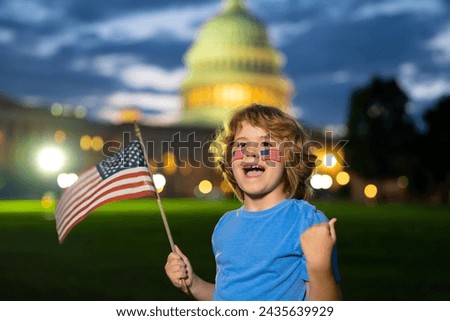 Excited child hold American flag. Patriotic holiday. Kid boy with American flag in Washington DC. USA kids celebrate independence day 4th of July. Portrait of American child with American Flag.