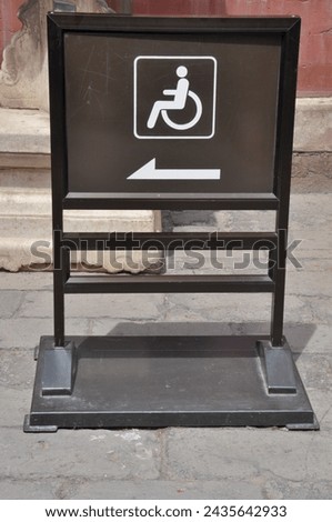 Signage for access by wheelchair users.