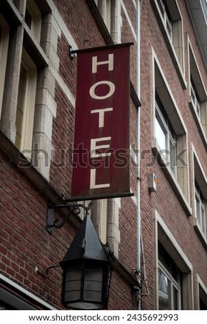 Closeup of Hotel sign on building facade in the street