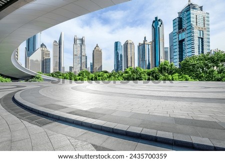 Round square floor and pedestrian bridge with modern city buildings scenery in Shanghai. Famous financial district landmark in Shanghai. Royalty-Free Stock Photo #2435700359
