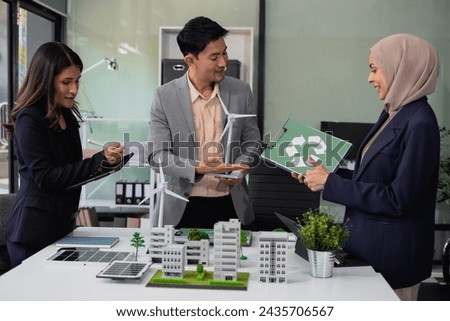 Businessman team using tablet for working technology and business,  Renewable energy-based green businesses and global warming. Reduce CO2 emission.