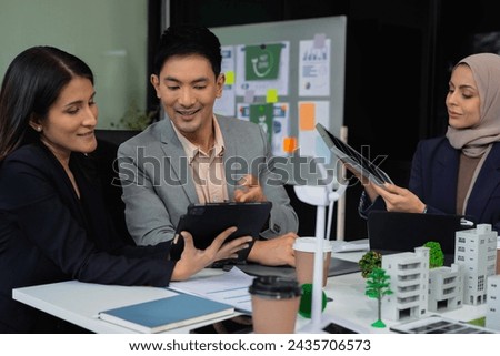 Businessman team using tablet for working technology and business,  Renewable energy-based green businesses and global warming. Reduce CO2 emission.