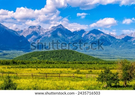 Beautiful landscape with valley and mountains on summer day. Valley of extinct volcanoes in Tunka park near Arshan village in Buryatia. Amazing nature, Eastern Sayan mountains, Siberia, Russia. Royalty-Free Stock Photo #2435716503