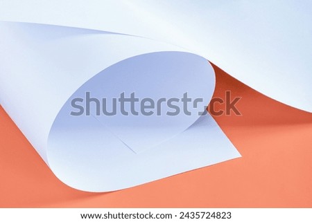 Sheets of white paper on an orange background. Pastel image as a background for various creative compositions.