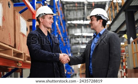 Project manager  and chief of engineer Handshake at the electrical train garage Royalty-Free Stock Photo #2435728819