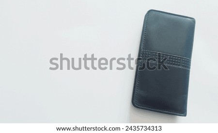 A black rounded corner leather wallet isolated on white background