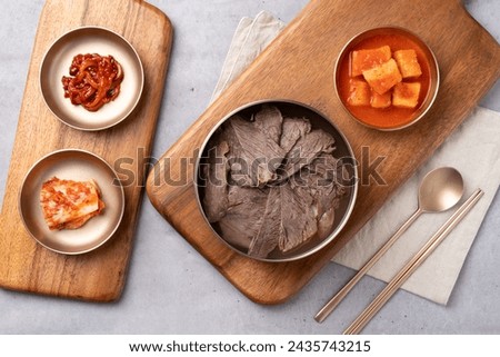 Korean food, Korean beef, gomtang, beef camouflage, crucible soup, boiled pork, beef tail, steamed, soup, side dishes, salted squid, kkakdugi, Royalty-Free Stock Photo #2435743215