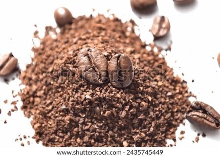 image of coffee. Coffee beans and powder on a simple white background.