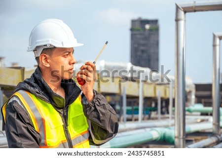The image captures a skilled engineer inspecting a network of pipelines in a petrochemical facility. the concept of projects related to petrochemicals, engineering, and industrial inspection.