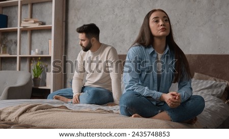 Sad annoyed Caucasian couple family spouses sit apart on bed offended man and woman relationship problem. Husband wife silence after conflict argue misunderstanding breakup divorce quarrel in bedroom Royalty-Free Stock Photo #2435748853