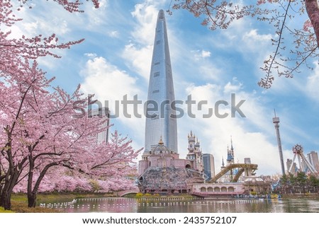 Lotte World Amusement Park and Seokchon Lake  in Spring Cherry blossoms bloom in late March-April.  Seoul, South Korea