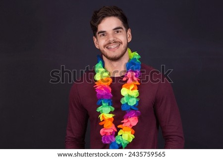 Handsome man with a Hawaiian flower necklace for party