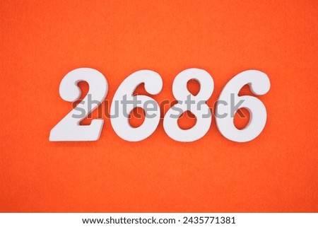 Orange felt is the background. The numbers 2686 are made from white painted wood.