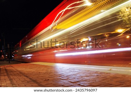 Train passing at high speed with slow shutter speed.