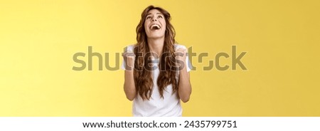 God finally yes. Relieved thankful pleased happy girl look up thank god fist pump celebration success win triumphing clench arms grateful delighted lucky opportunity stand yellow background. Royalty-Free Stock Photo #2435799751