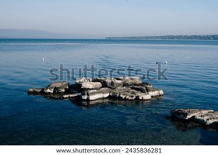 large stone slabs in Lake Geneva. High quality photo