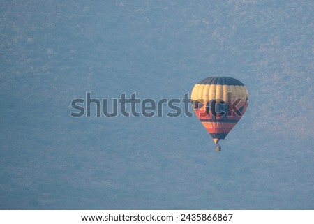Colorful hot air balloon safari, observed in South Africa, in Pilanesberg National Park Royalty-Free Stock Photo #2435866867