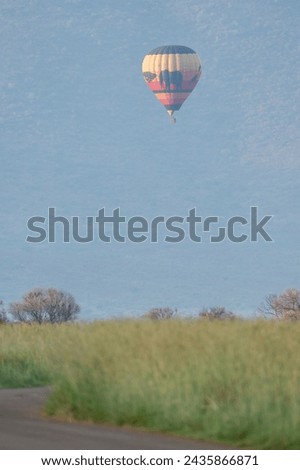 Colorful hot air balloon safari, observed in South Africa, in Pilanesberg National Park Royalty-Free Stock Photo #2435866871