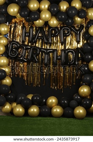 Happy birthday background with golden and black balloons