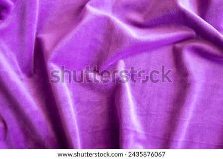 Lilac knitted texture fabric. Purple textile cloth background. Soft material for fashion clothes.