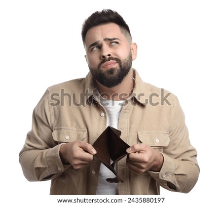Thoughtful man showing empty wallet on white background