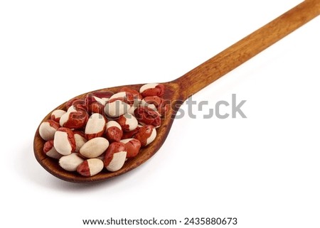 Red Anasazi Beans on wooden spoon, isolated on a white background. Spotted beans. Kidney beans Royalty-Free Stock Photo #2435880673