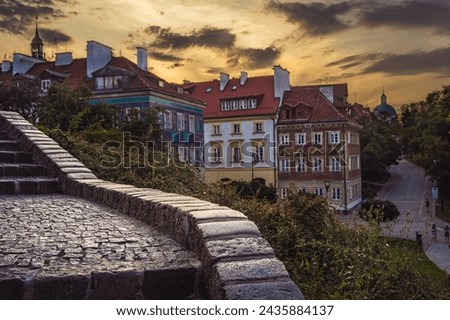 beautiful view of the city at sunset. It is worth seeing life on the streets in Warsaw in the summer at sunset Royalty-Free Stock Photo #2435884137
