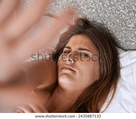 Woman, bed and morning wakeup annoyed, pov and female person resting on pillow and calm. Relax in apartment for tired girl , comfort and fatigue for mental health and wellbeing with hand gesture Royalty-Free Stock Photo #2435887133