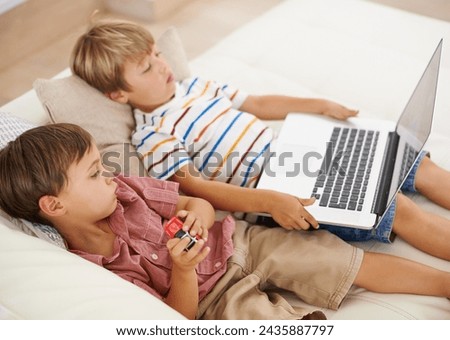 Laptop, relax and kids on sofa in home, learning and family streaming cartoon on internet together. Computer, children and boys in living room for education, movies or brothers with games in house