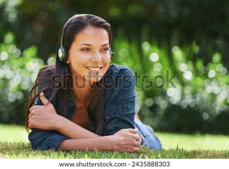 Grass, thinking and woman with headphones, listening to music and streaming audio with peace, relaxing and sunshine. Person in a park, outdoor and girl with headset and podcast with radio and sound