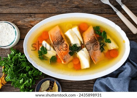 Roast salmon and halibut in jelly with vegetables on white background 