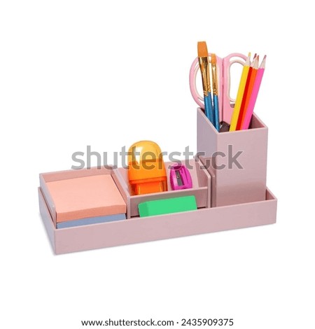Compartment with a cute stationery set, containing several spaces to store study or office supplies. Box for school, office work or industry, craft supplies for homework isolated on white background Royalty-Free Stock Photo #2435909375