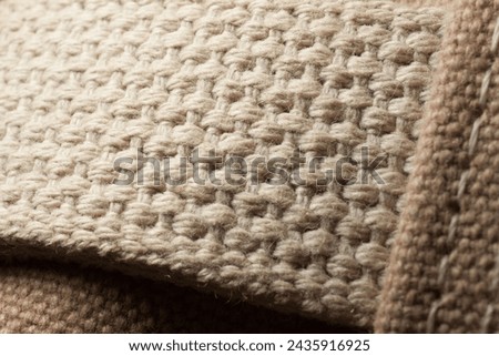 Sand color canvas, macro cotton textile Royalty-Free Stock Photo #2435916925