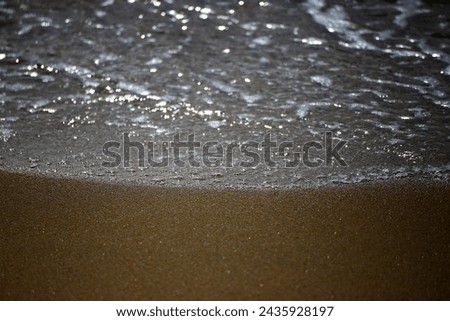 The sea waves at the beach are beautiful.