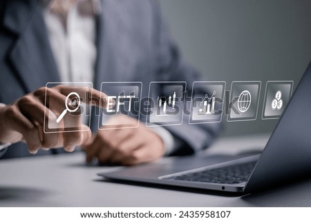 ETF, Exchange traded fund. Financial technology business investment concept. Businessman using laptop with ETF icons on virtual screen.