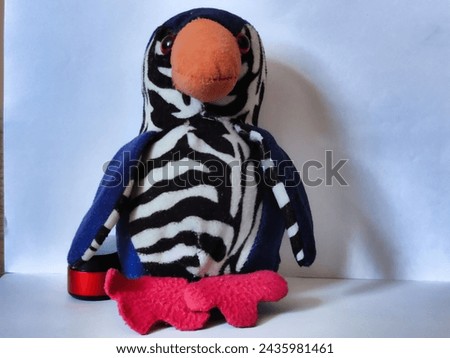 Picture of a toy penguin isolated on a white background shot during dayight