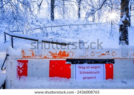 warning sign in german - translation: path closed due to snowfall - photo