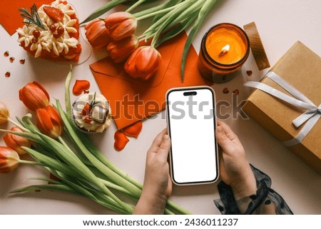 Phone with isolated screen on background of spring decor.